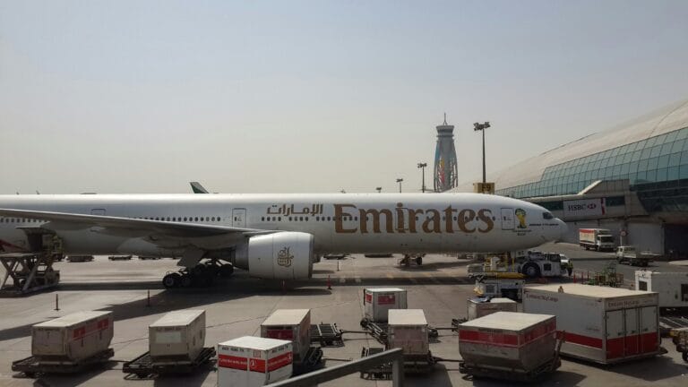 Dubai International Airport terminal and Emirates aircraft