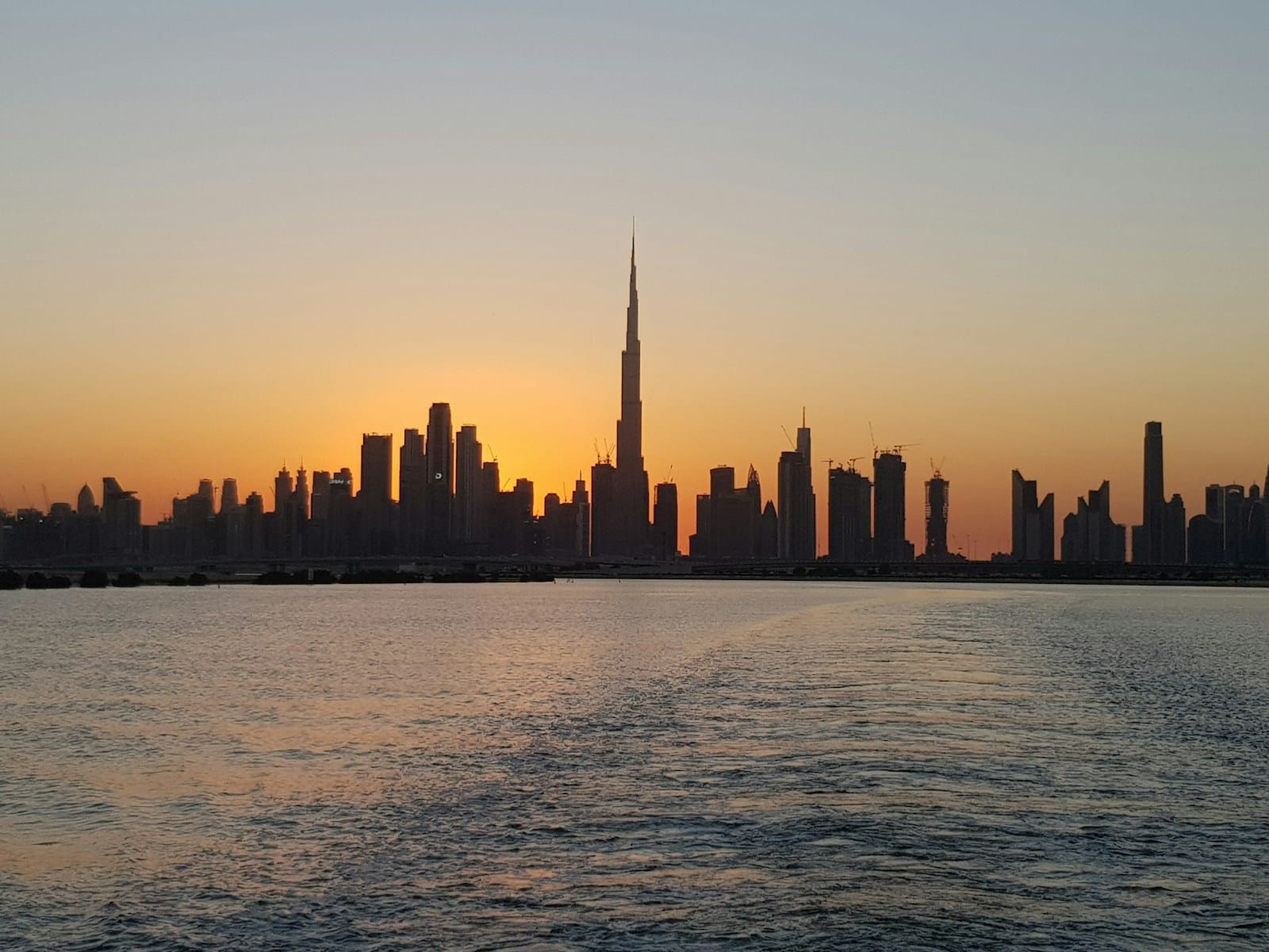 Dubai skyline and waterfront at sunset