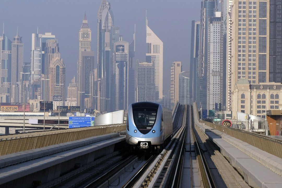 Dubai Metro train running above the city skyline, illustrating public transport in Dubai