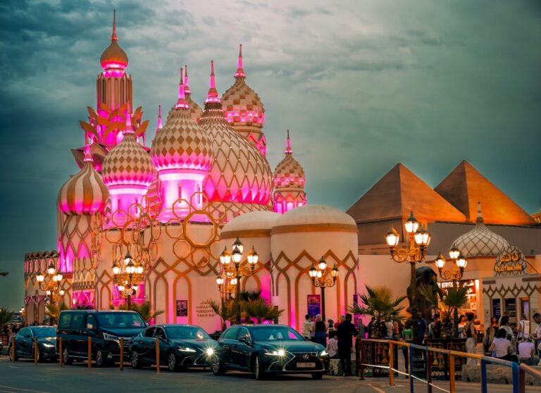Illuminated visitor attraction entrance near Global Village Dubai, useful for planning arrival and parking